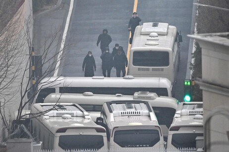 Security personnel blocking an entrance gate to protect impeached president Yoon Suk Yeol