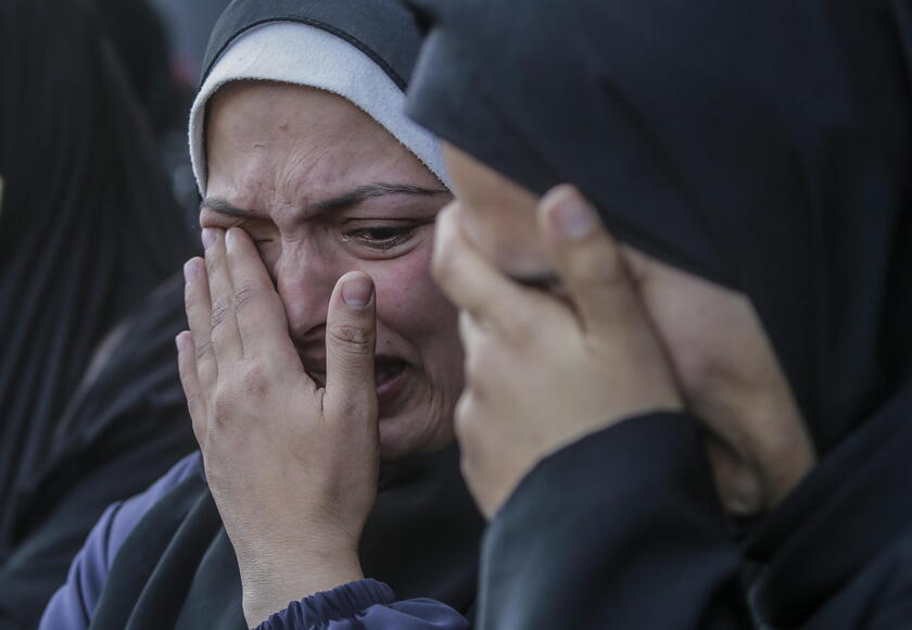 Palestinians mourn their dead at Deir Al Balah hospital after Israeli airstrike in central Gaza