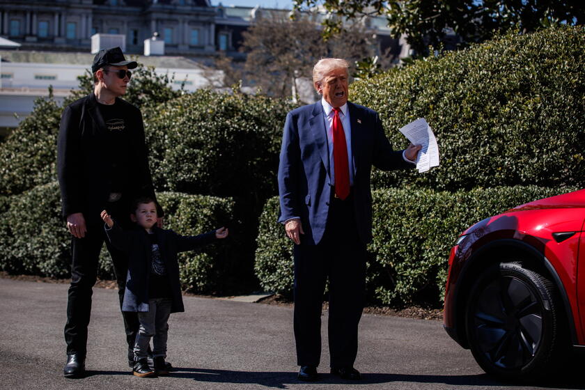 US President Trump views Tesla vehilces in front of the White House