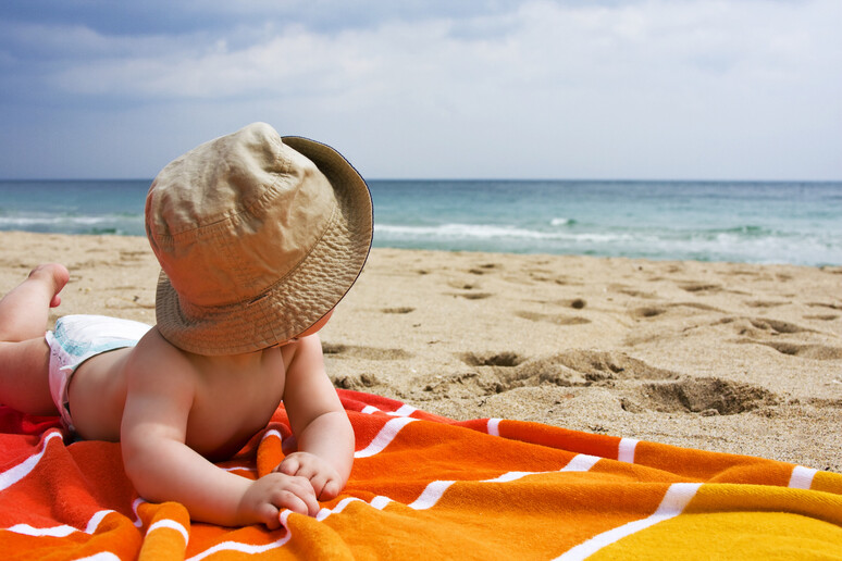 Bambini sulla spiaggia - RIPRODUZIONE RISERVATA